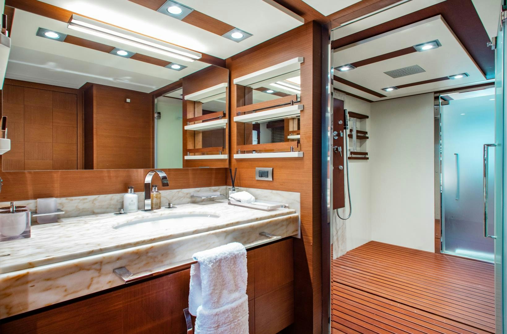 a bathroom with a sink and a mirror aboard ARREEE! Yacht for Sale