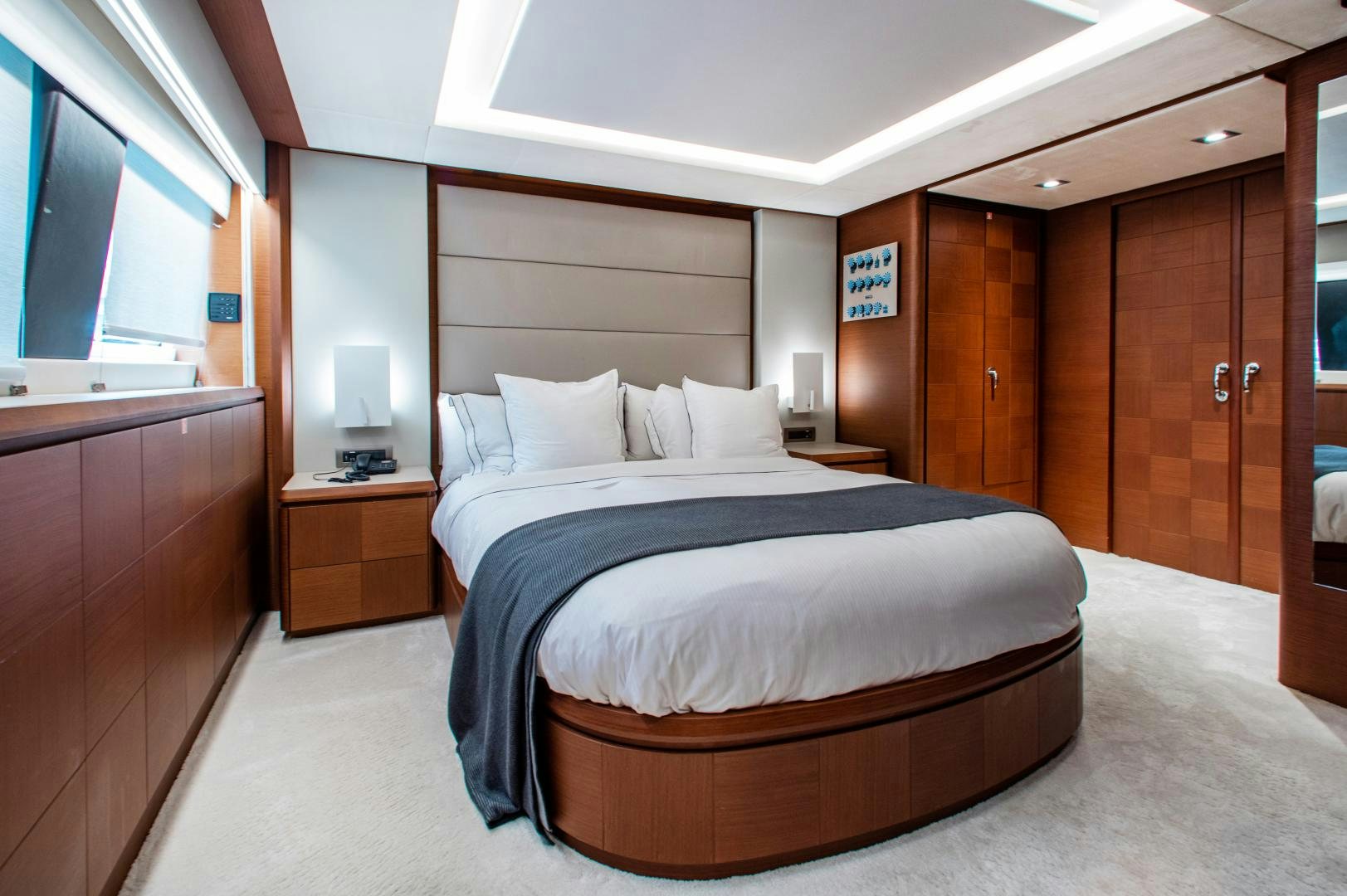 a room with a bed and a wood door aboard ARREEE! Yacht for Sale