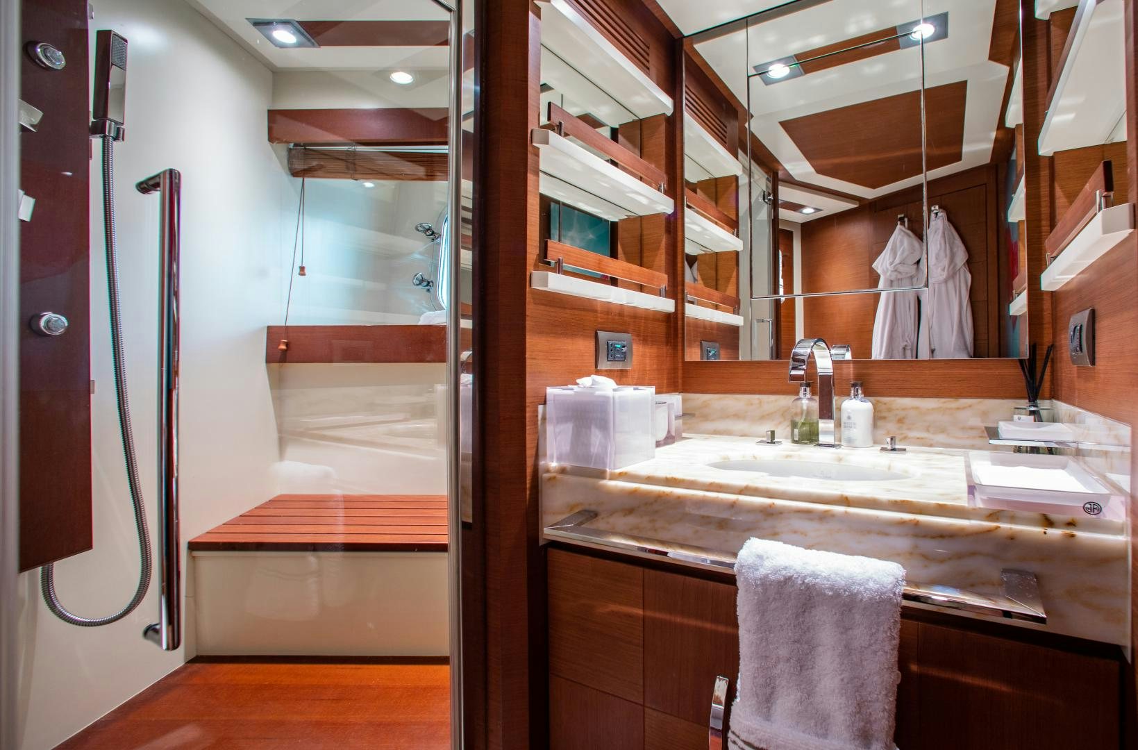a bathroom with a sink and a mirror aboard ARREEE! Yacht for Sale
