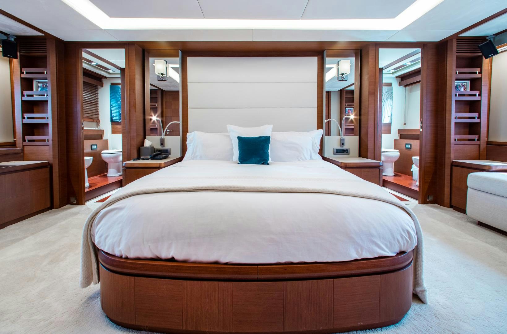 a large bed in a hotel room aboard ARREEE! Yacht for Sale