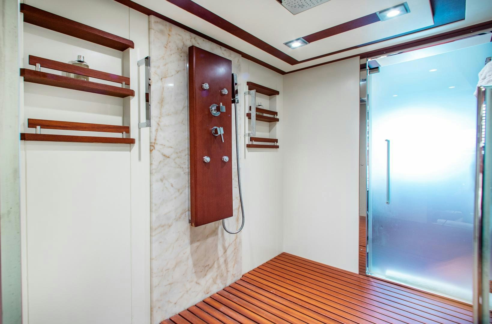 a room with a wood floor and a door with a window aboard ARREEE! Yacht for Sale