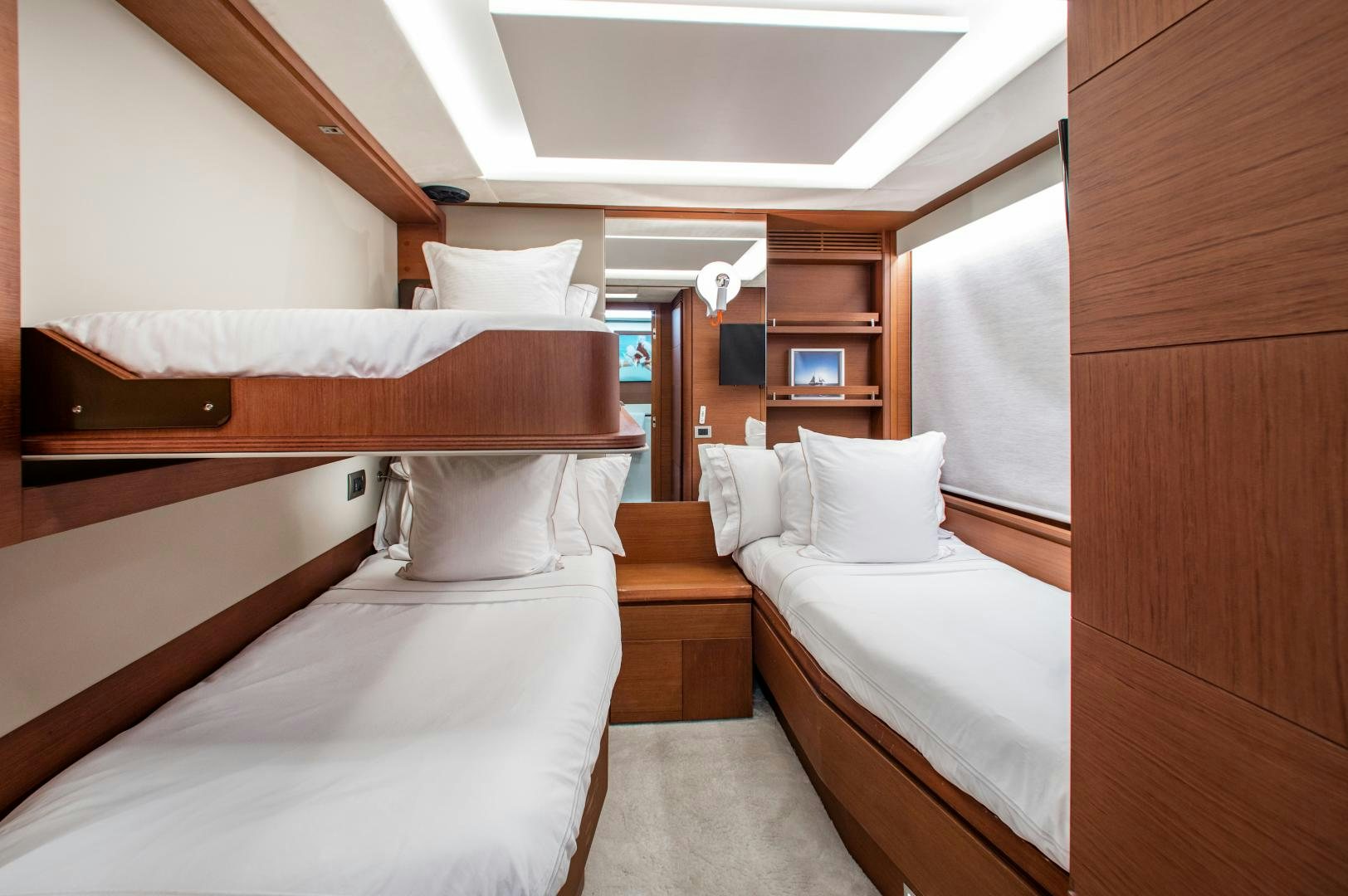 a room with beds and a tv aboard ARREEE! Yacht for Sale