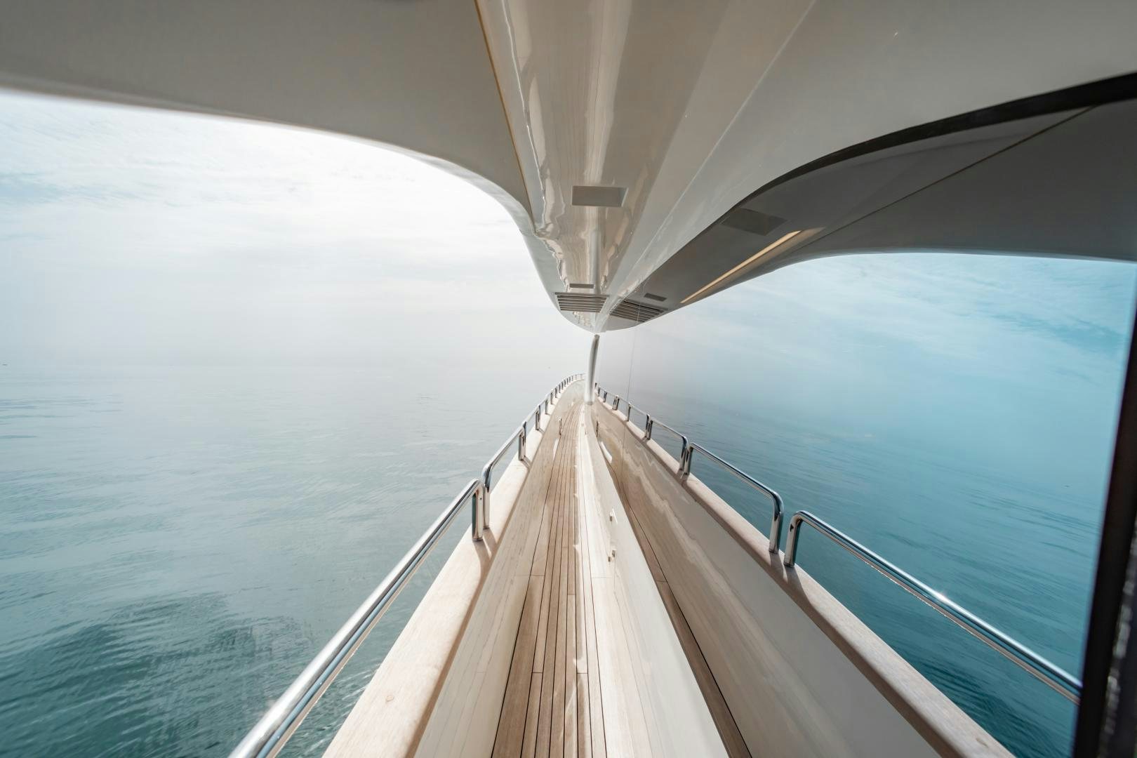 a long wooden bridge over water aboard ARREEE! Yacht for Sale