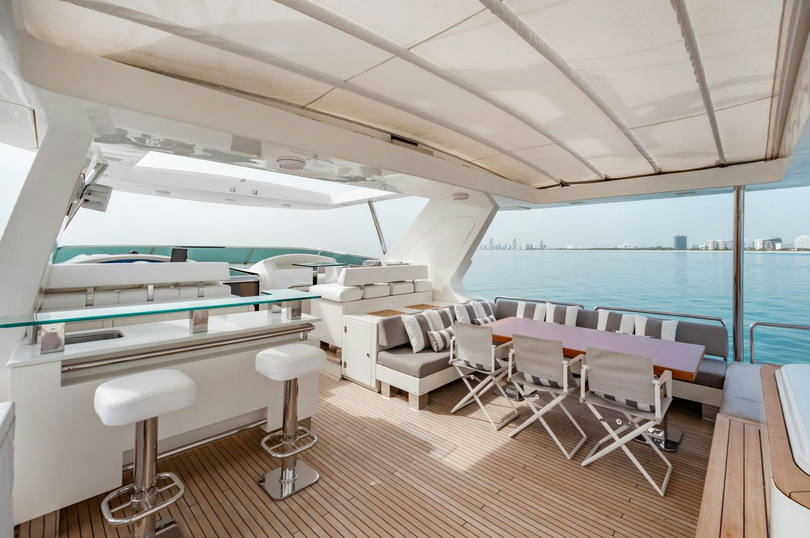 a room with a boat and chairs aboard ARREEE! Yacht for Sale