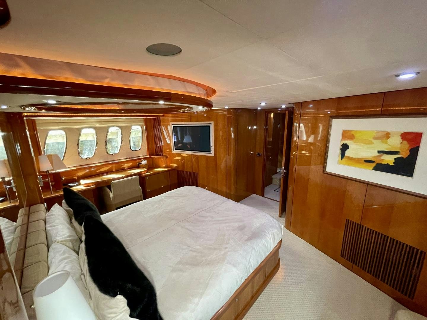 a bedroom with a bed and a television aboard BELLA Yacht for Sale