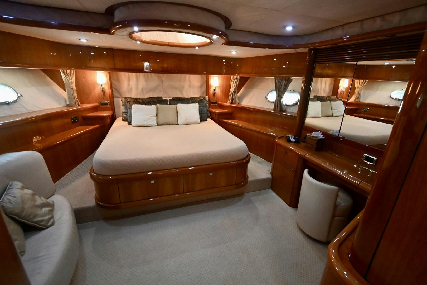 a room with a bed and a desk aboard BELLA Yacht for Sale