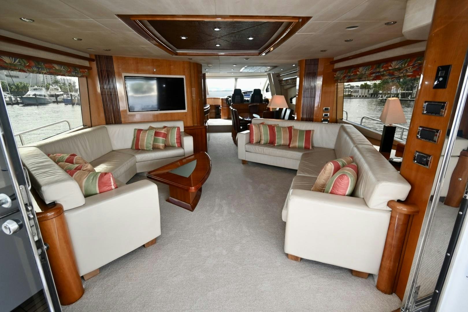 a living room with a couch and a television aboard BELLA Yacht for Sale
