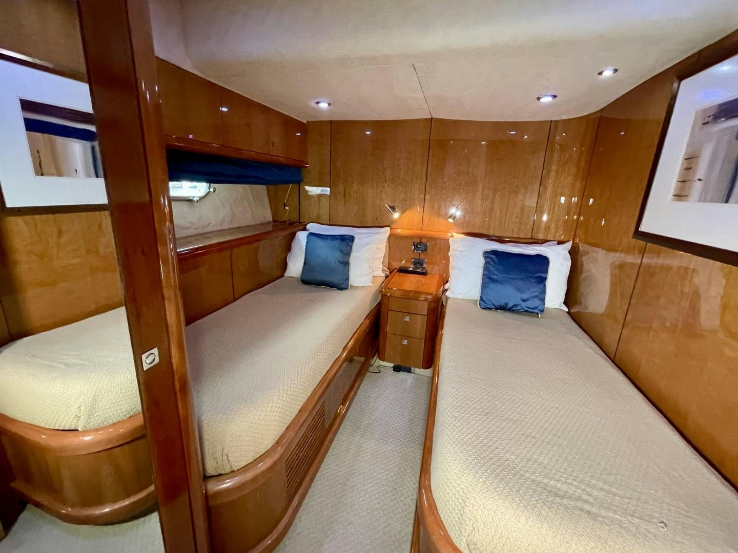 a room with beds and a wood wall aboard BELLA Yacht for Sale