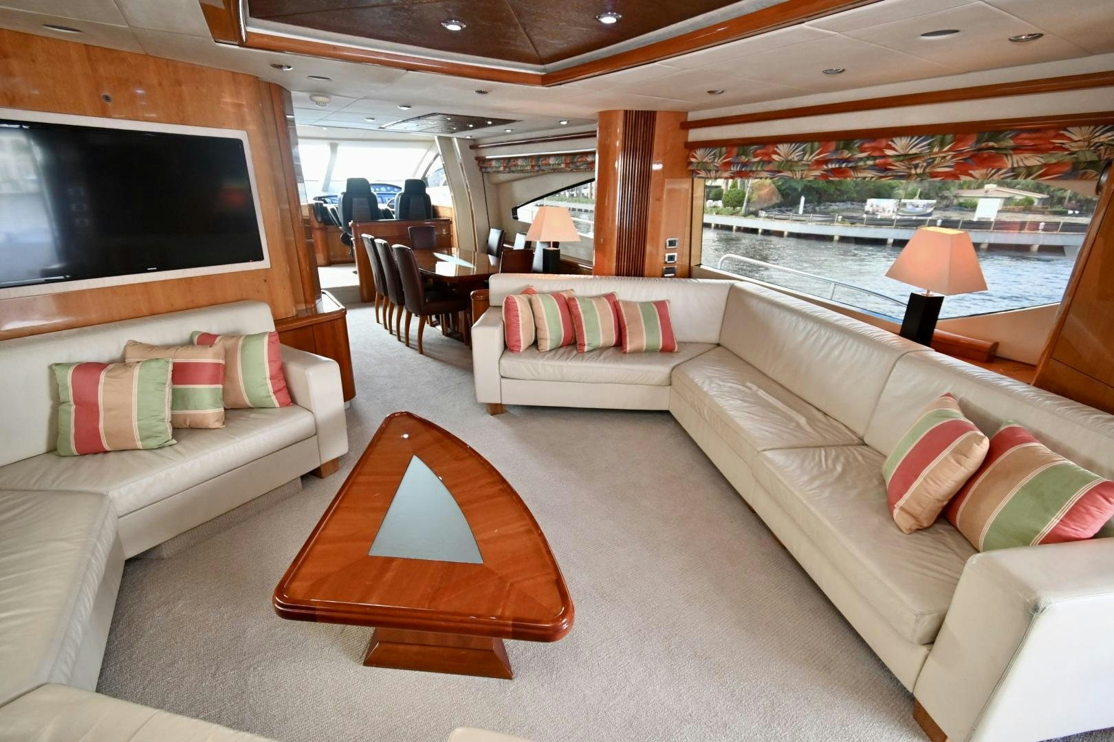 a living room with a couch and a television aboard BELLA Yacht for Sale