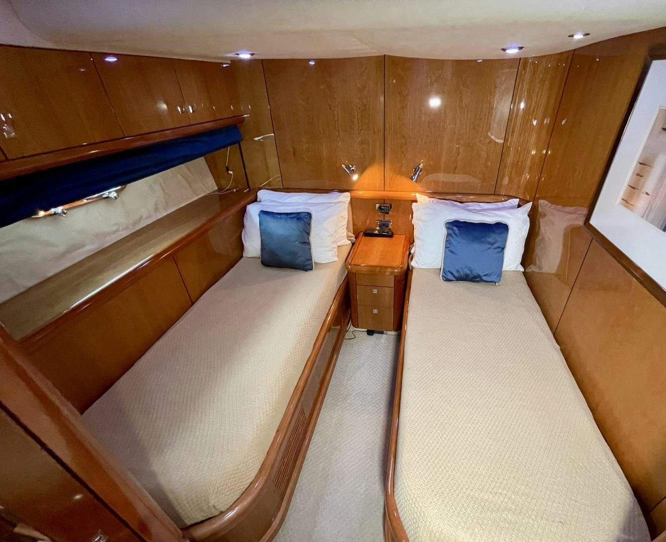 a room with a bed and a window aboard BELLA Yacht for Sale