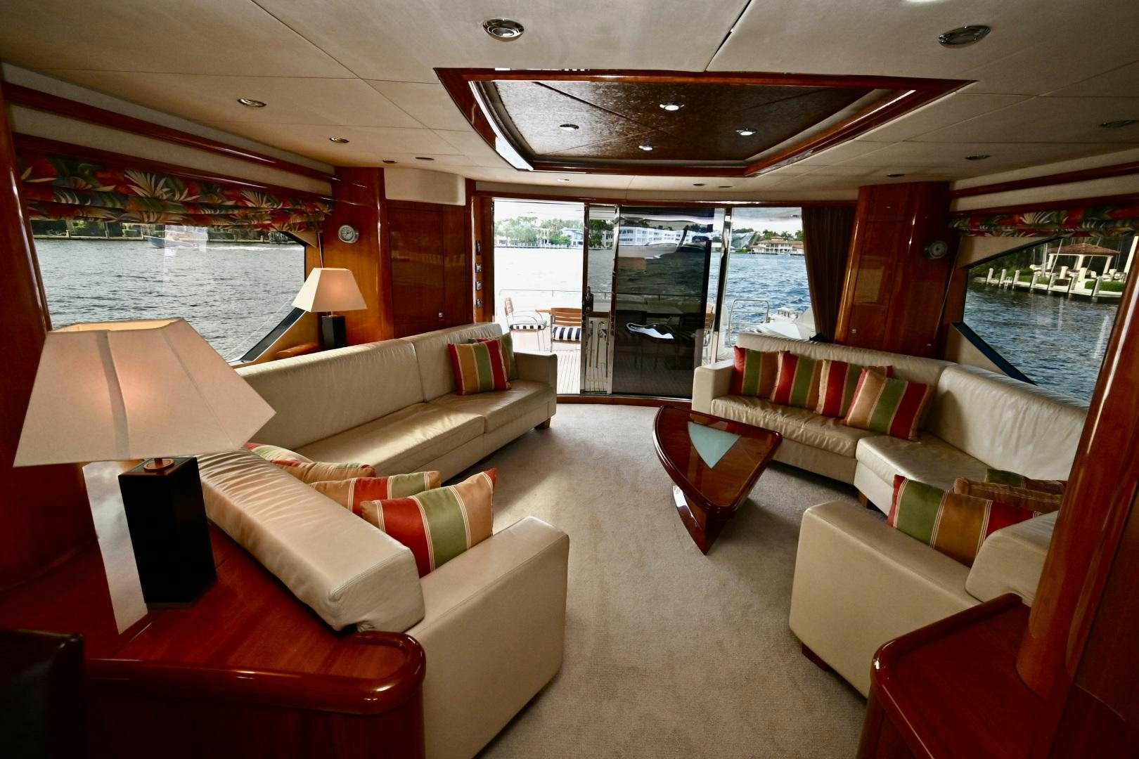 a living room with a large window aboard BELLA Yacht for Sale