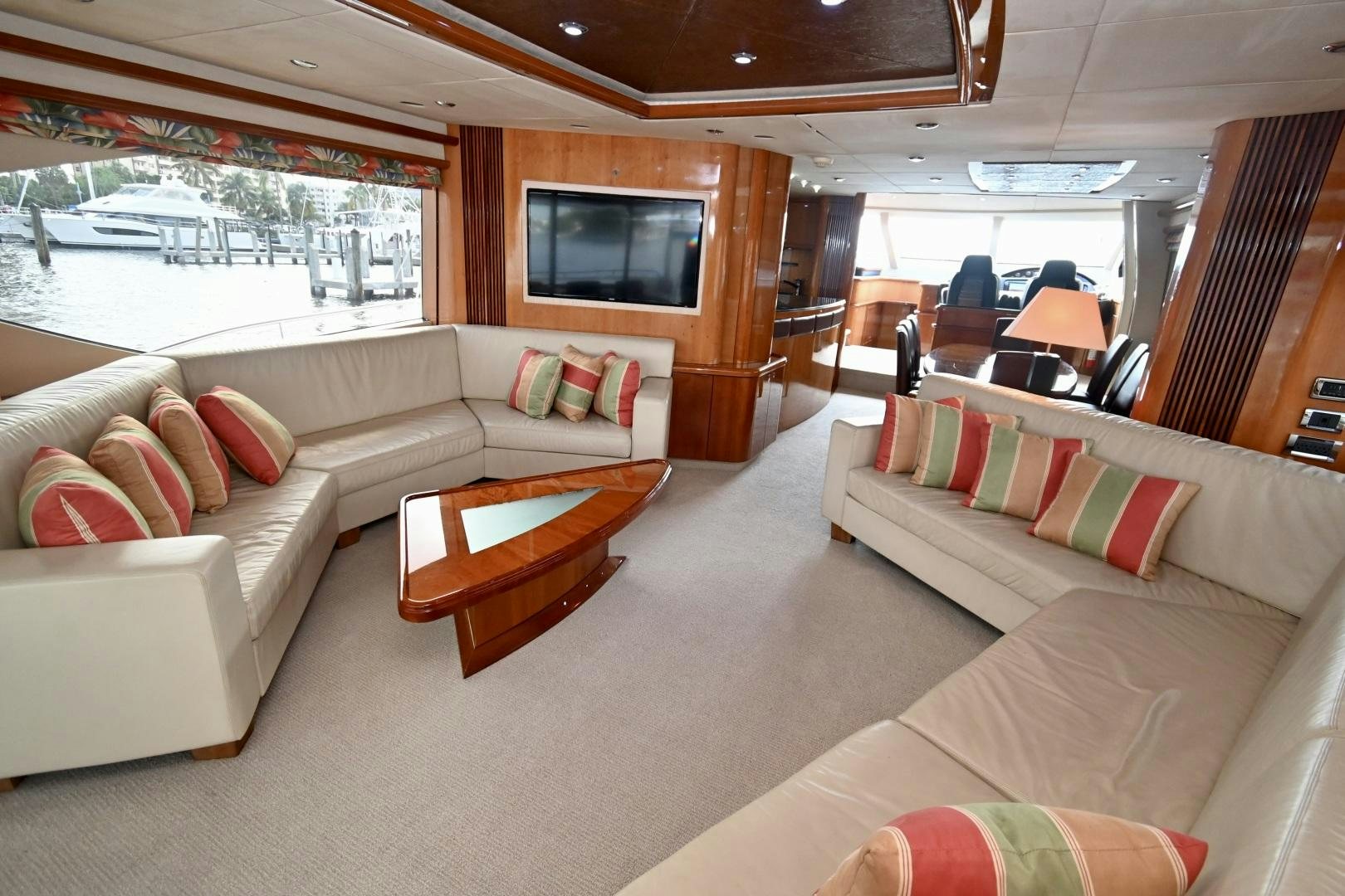 a living room with a couch and a television aboard BELLA Yacht for Sale