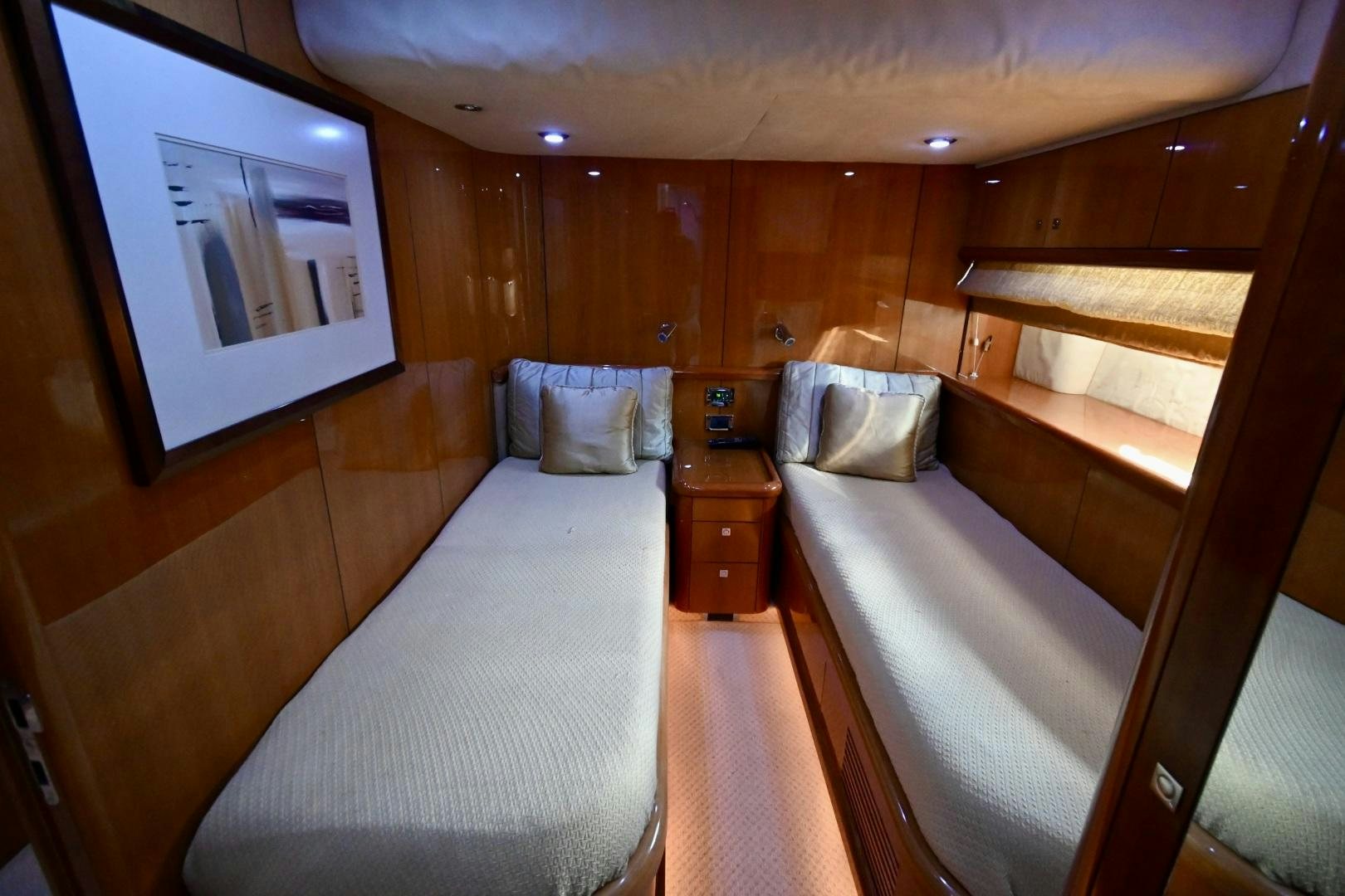 a room with a bed and a chair aboard BELLA Yacht for Sale