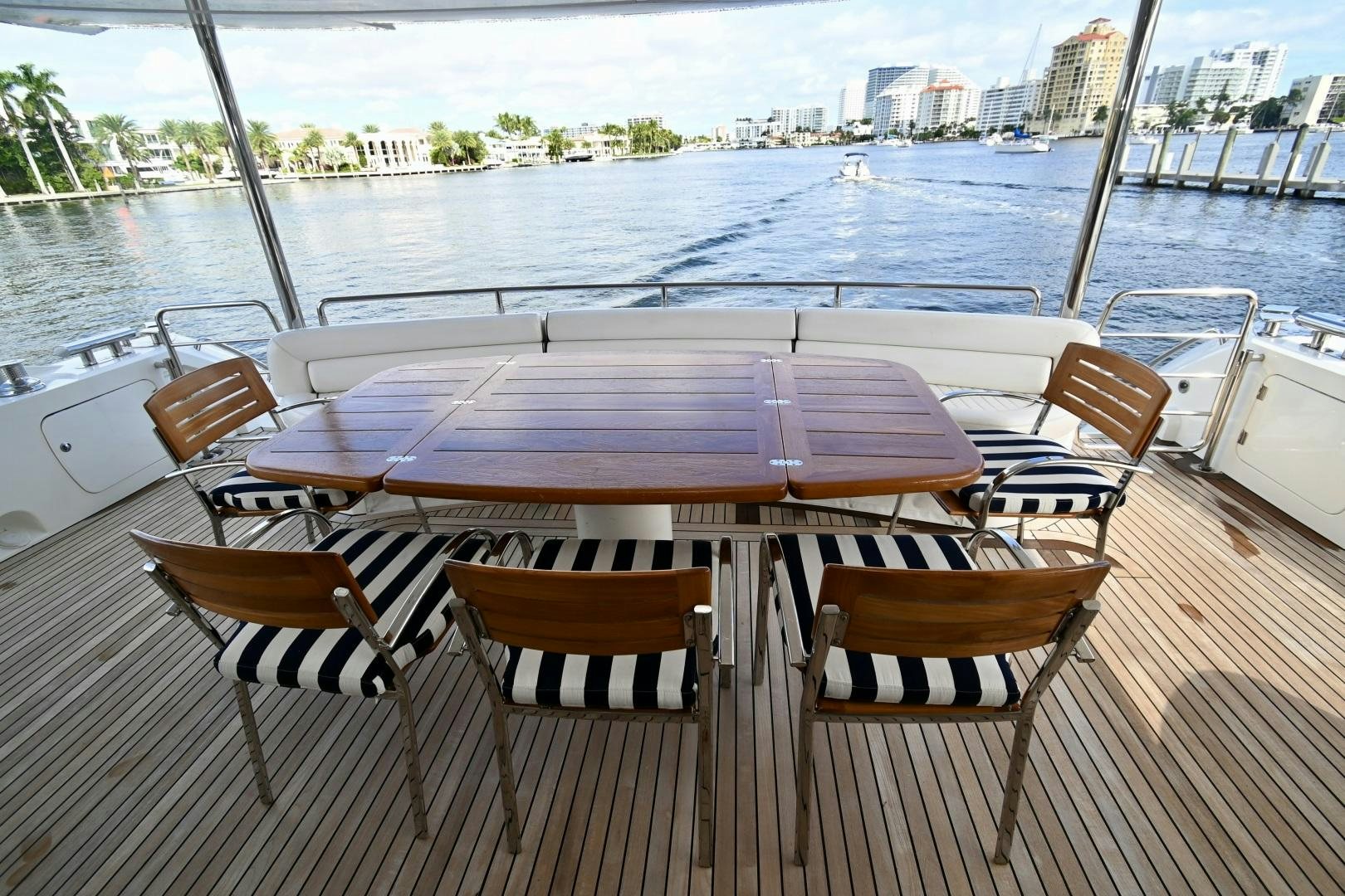 a table and chairs on a boat aboard BELLA Yacht for Sale