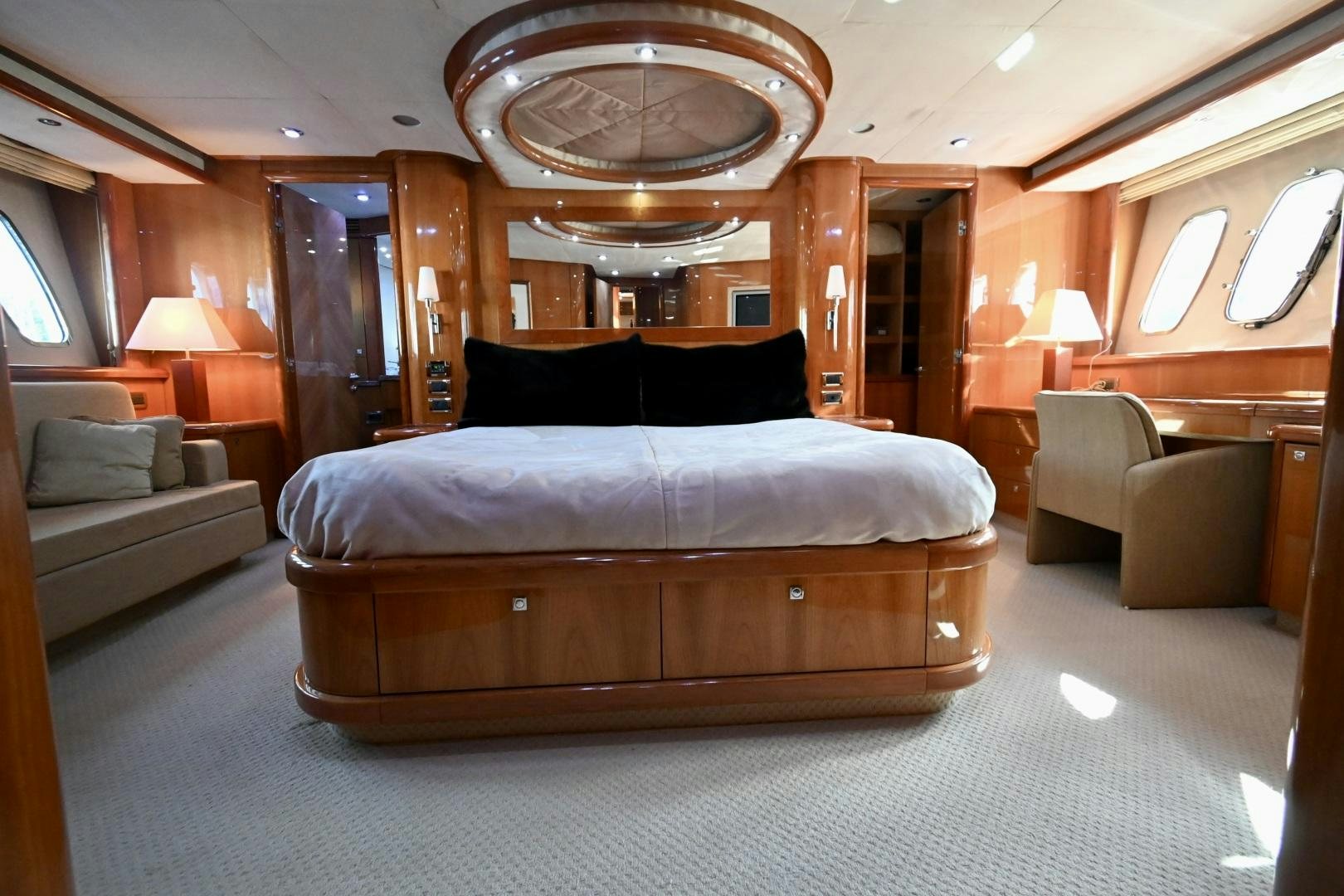 a large bed in a room aboard BELLA Yacht for Sale