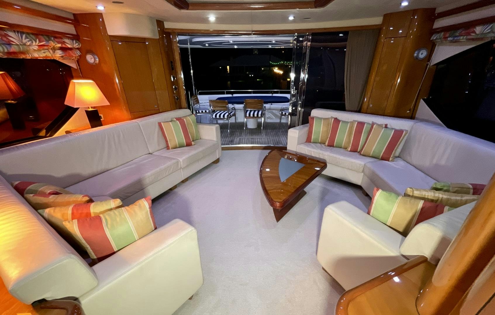 a room with couches and tables aboard BELLA Yacht for Sale