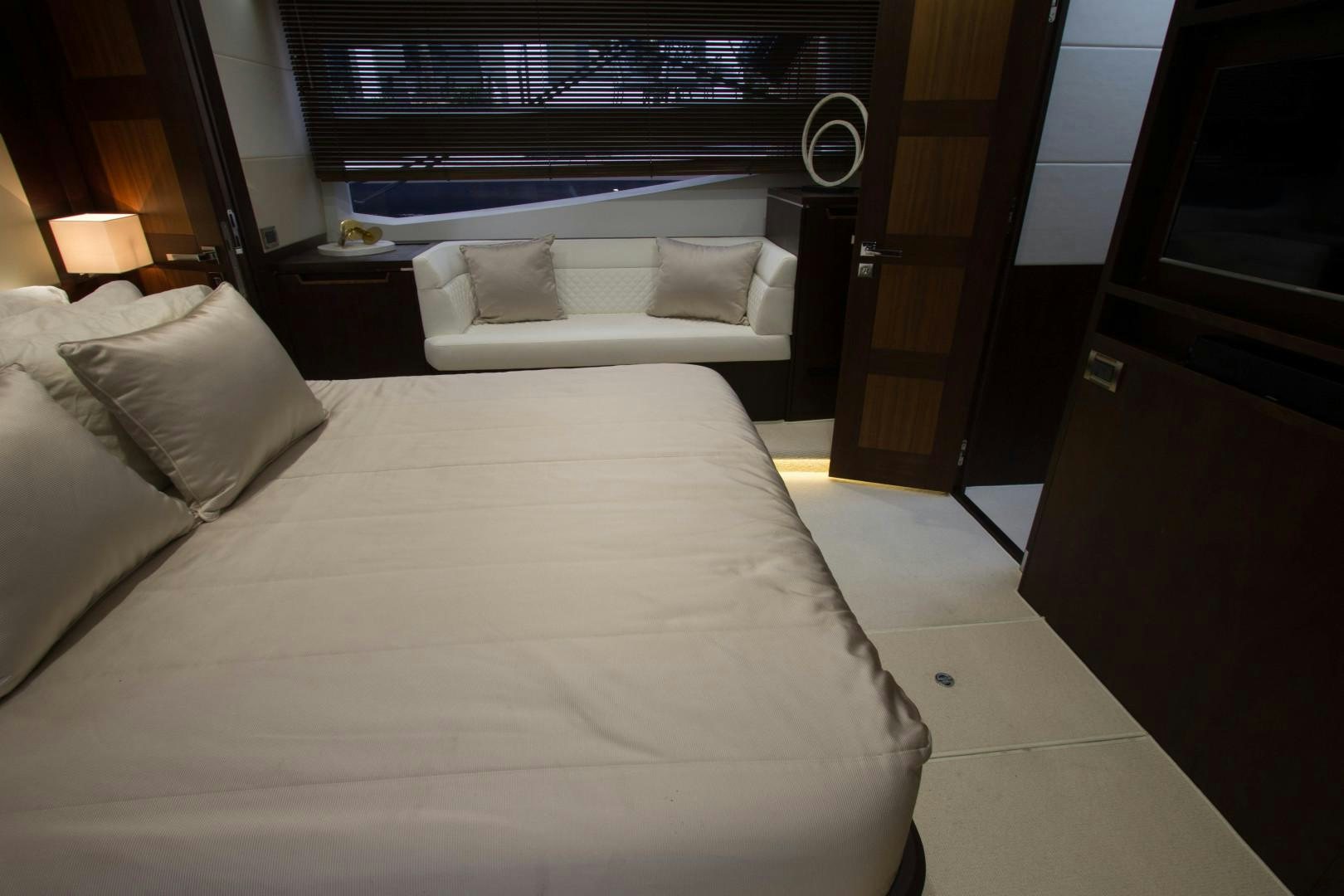 a bed with white sheets aboard MOODSWING Yacht for Sale