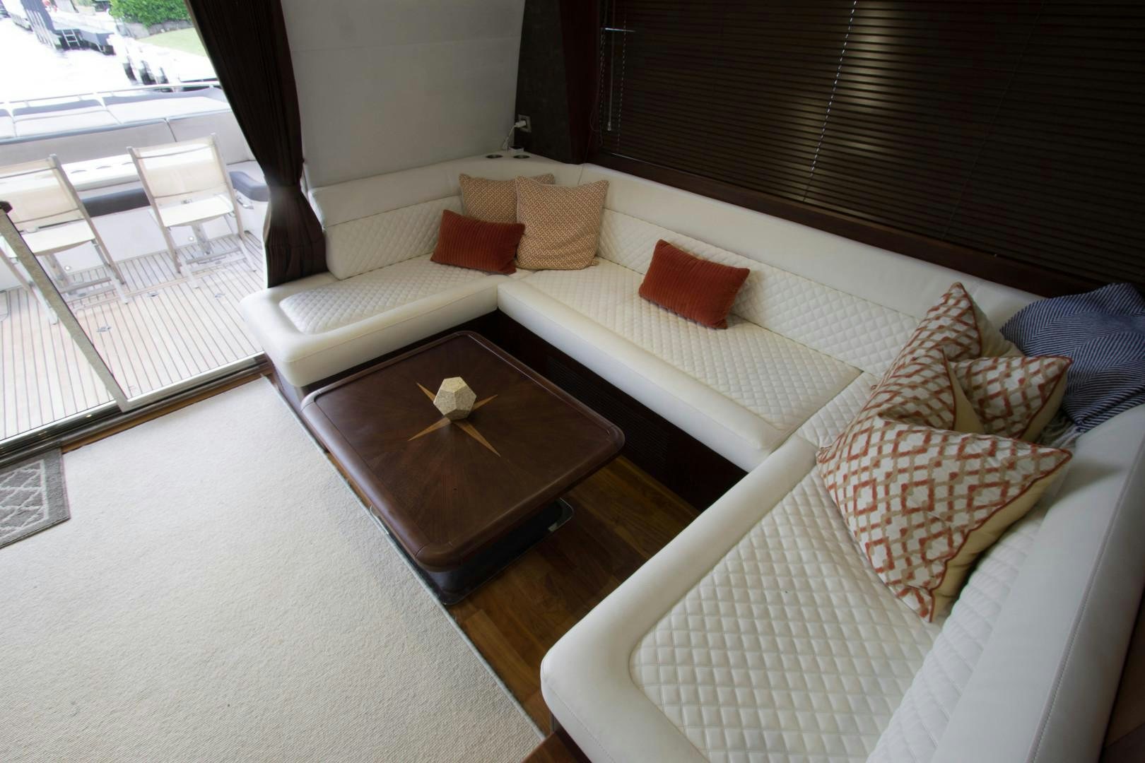 a room with a couch and a table aboard MOODSWING Yacht for Sale