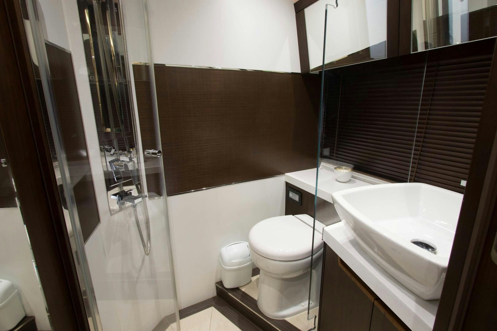 a bathroom with a toilet and sink aboard MOODSWING Yacht for Sale