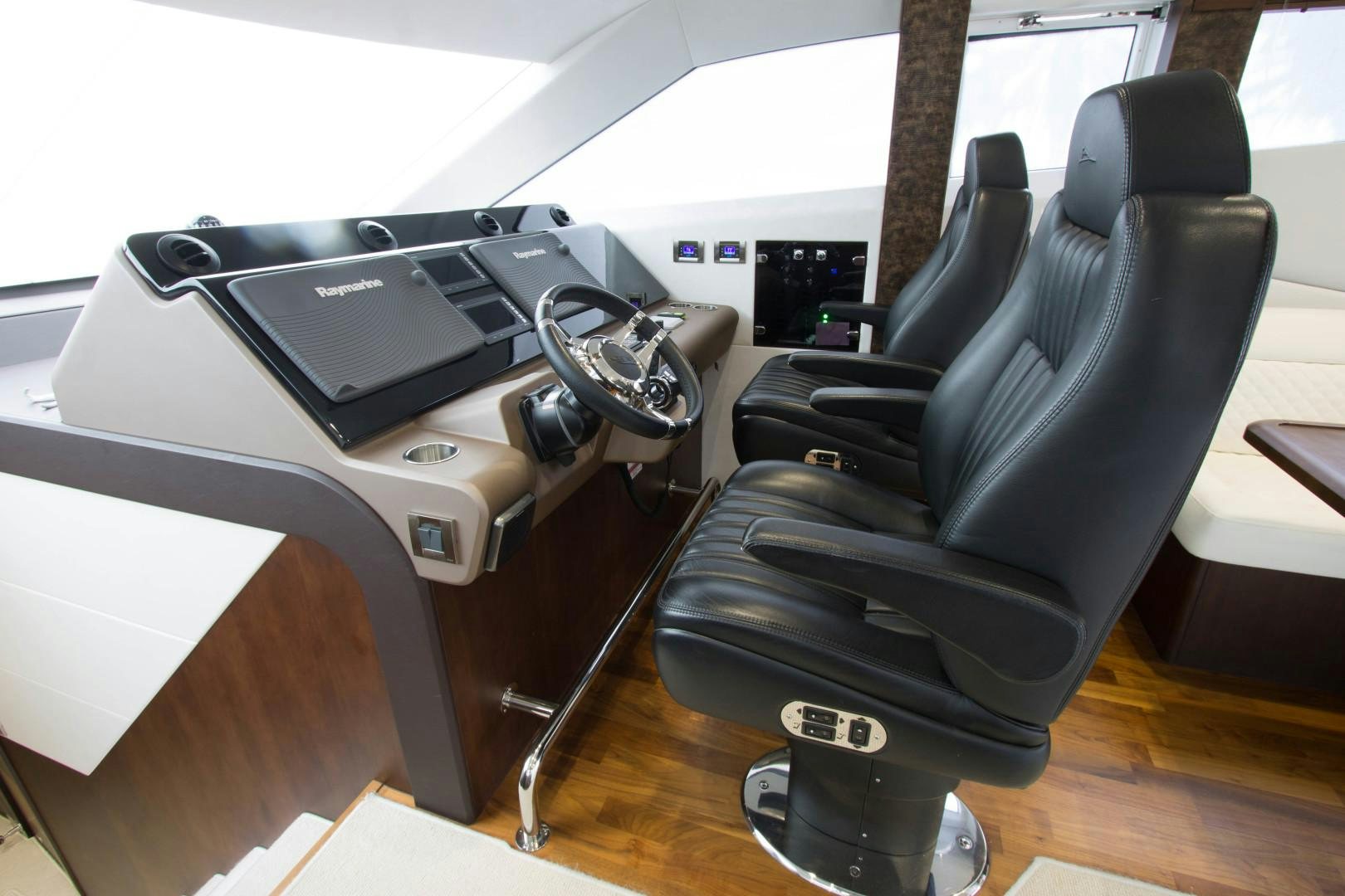 a black office chair next to a black computer desk aboard MOODSWING Yacht for Sale