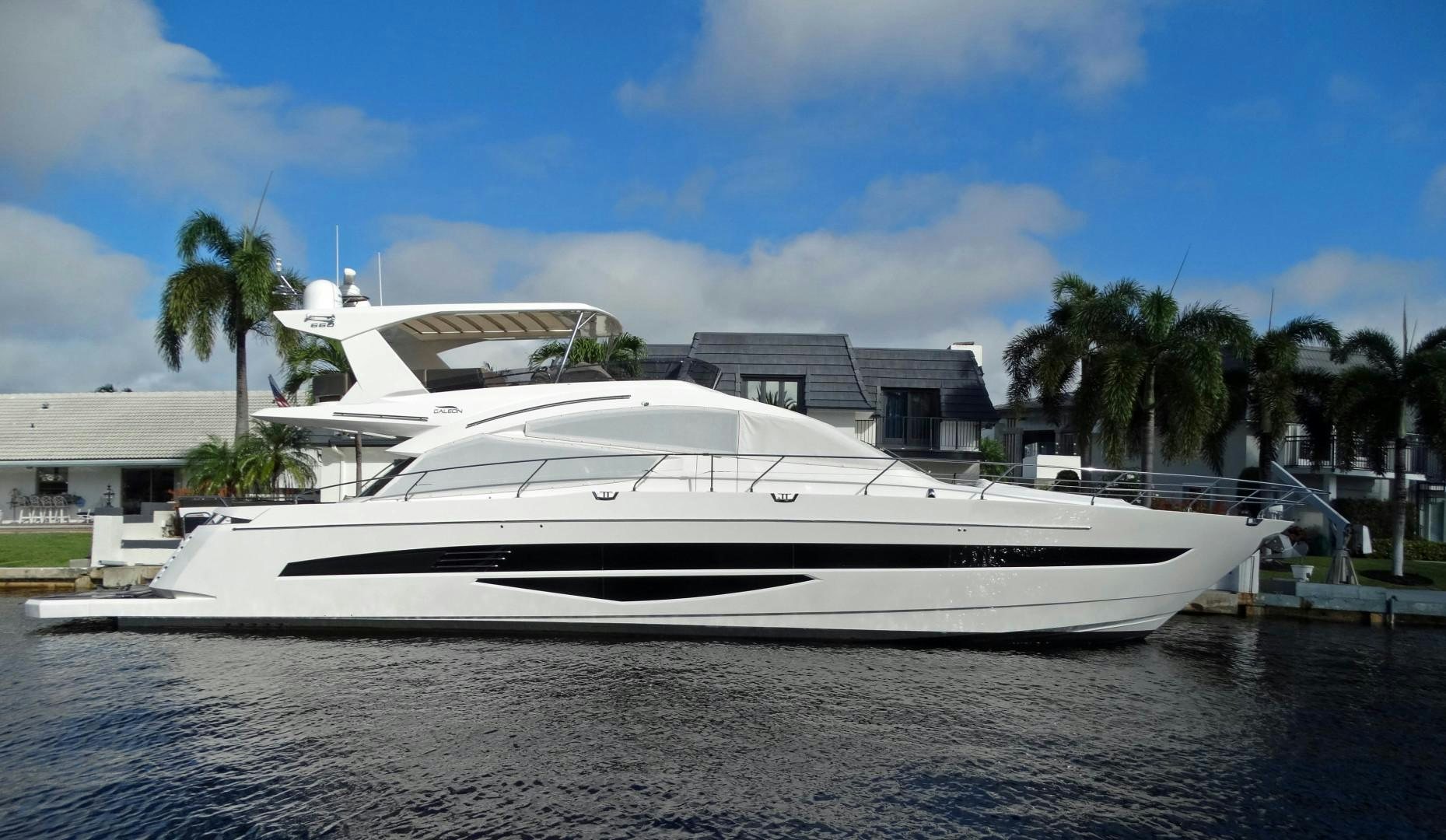 a white yacht on a beach aboard MOODSWING Yacht for Sale