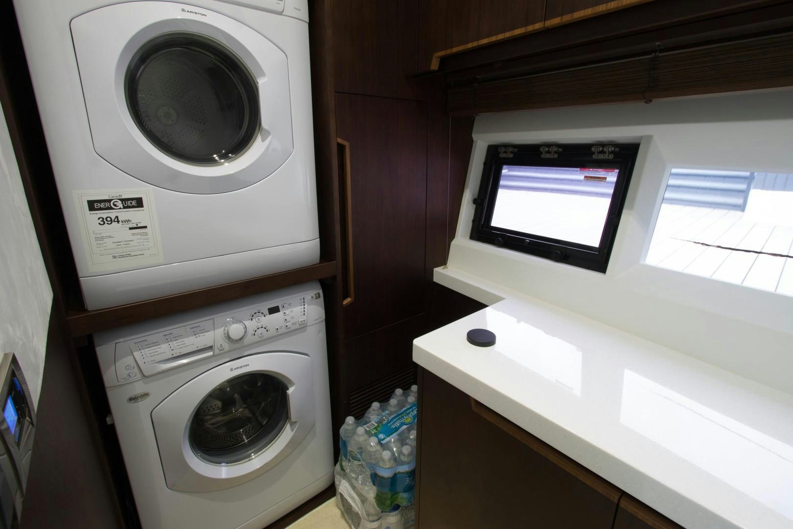 a washer and dryer in a room aboard MOODSWING Yacht for Sale