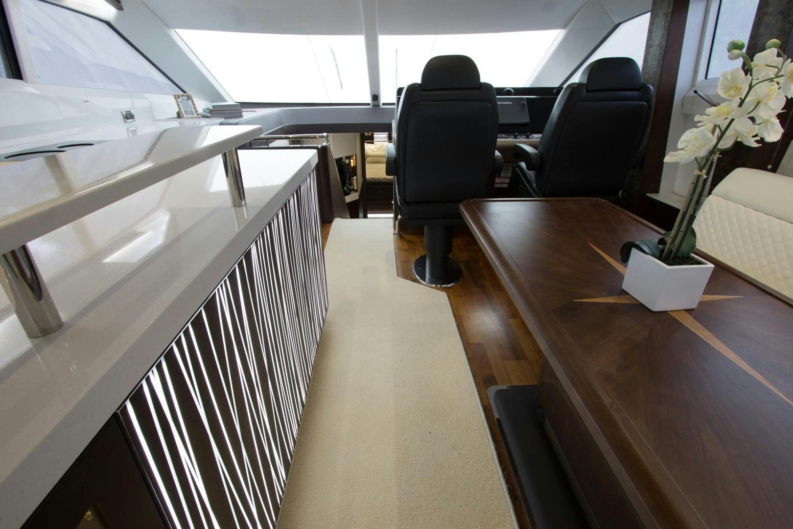 a room with a chair and a table aboard MOODSWING Yacht for Sale