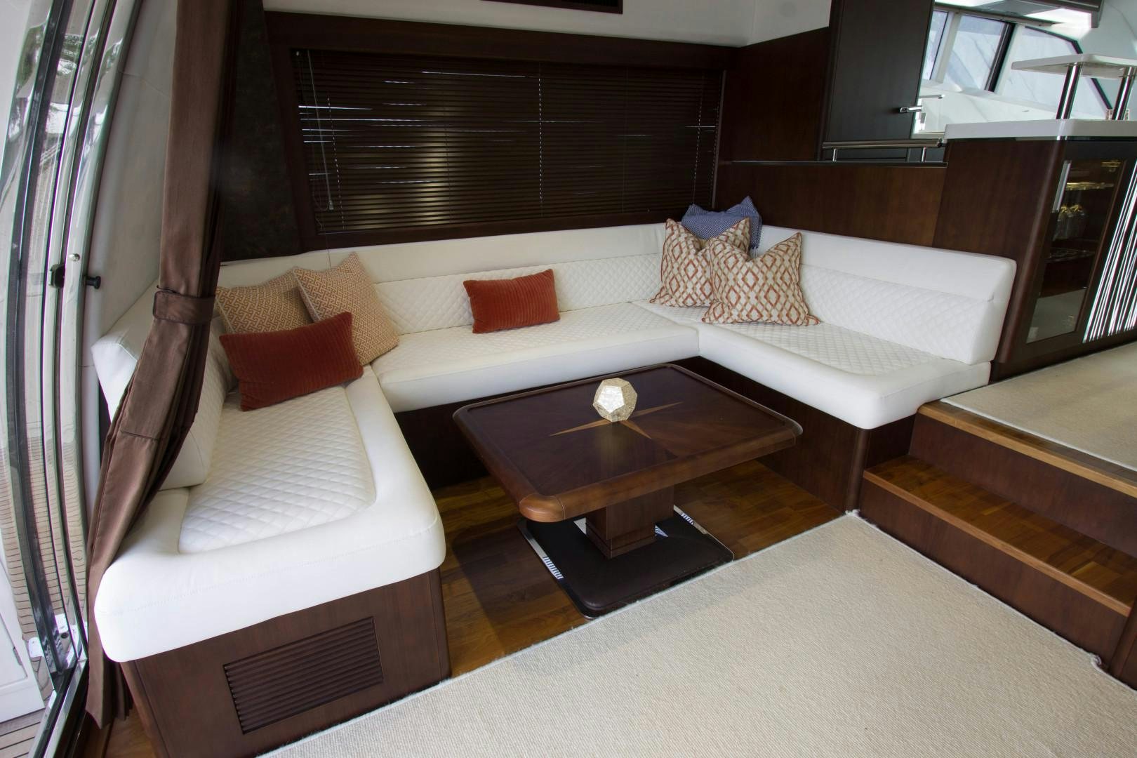 a room with a bed and a coffee table aboard MOODSWING Yacht for Sale