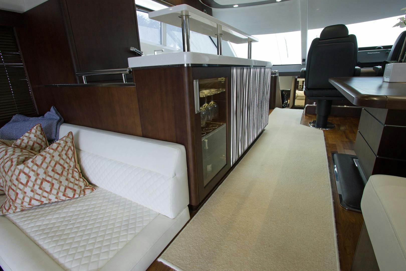 a room with a bed and a chair aboard MOODSWING Yacht for Sale