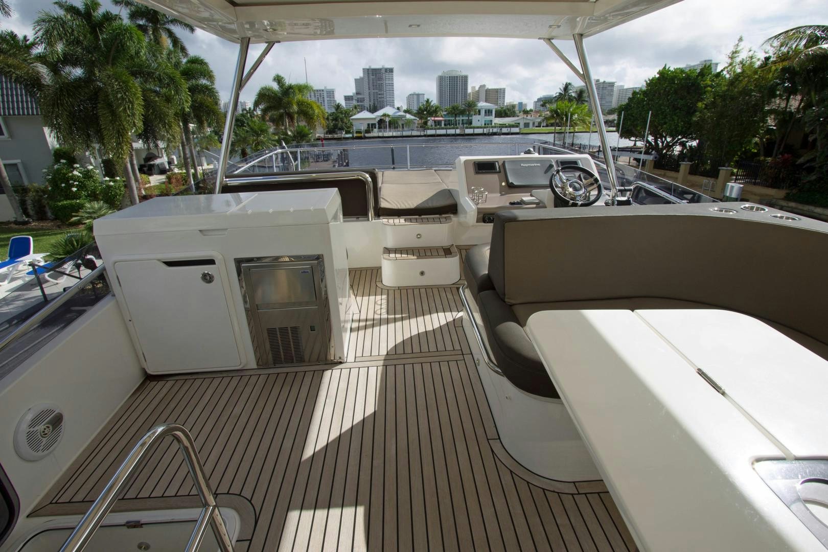 a deck with a deck and a view of a city aboard MOODSWING Yacht for Sale
