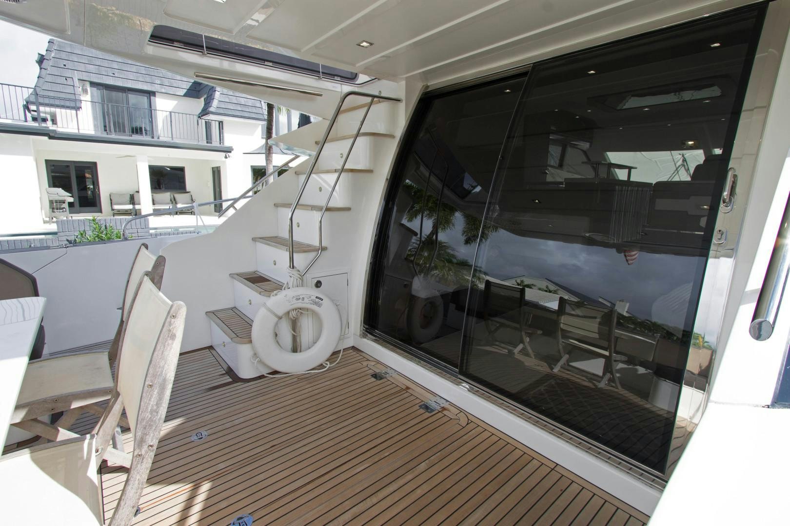 a room with a large window and a staircase aboard MOODSWING Yacht for Sale