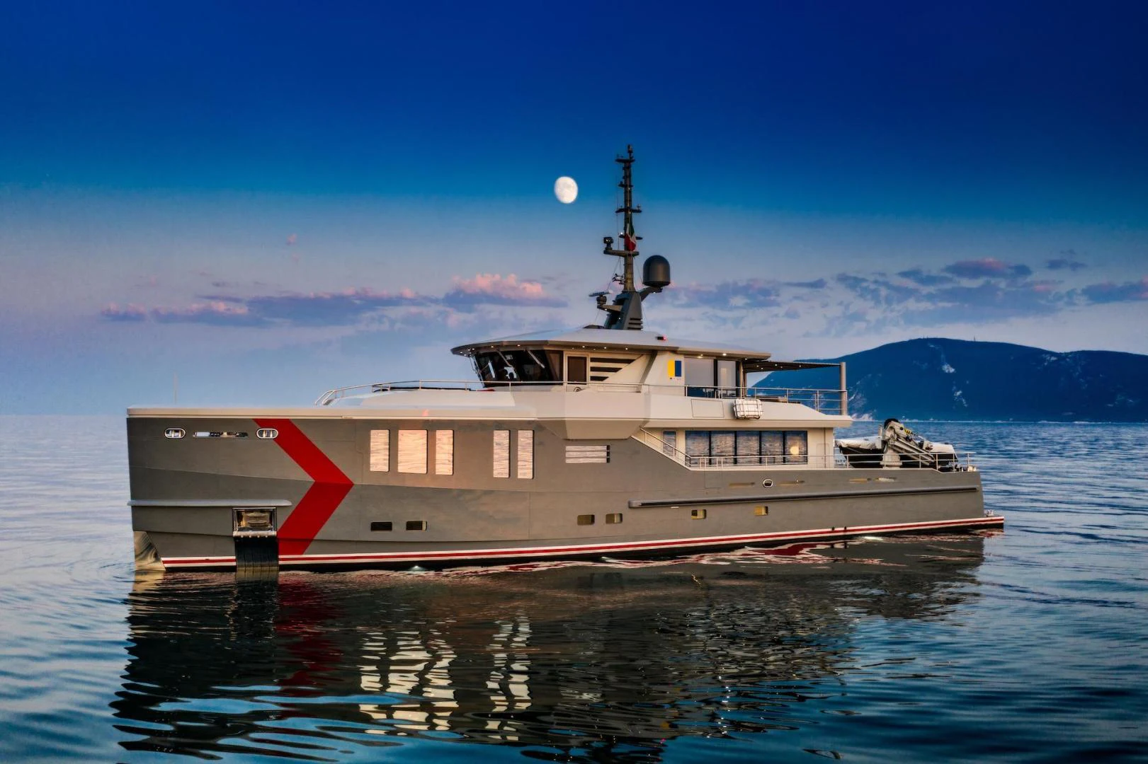 a large ship in the water aboard ATOM Yacht for Sale