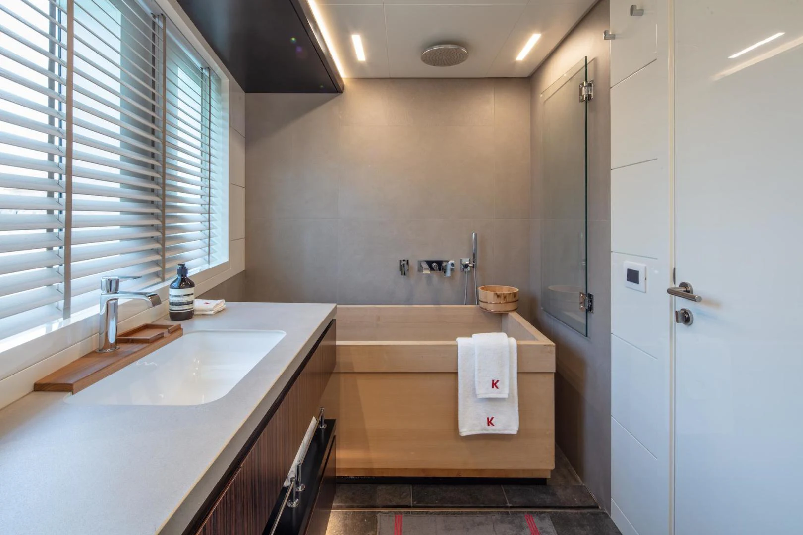 a kitchen with a countertop sink and cabinets aboard ATOM Yacht for Sale