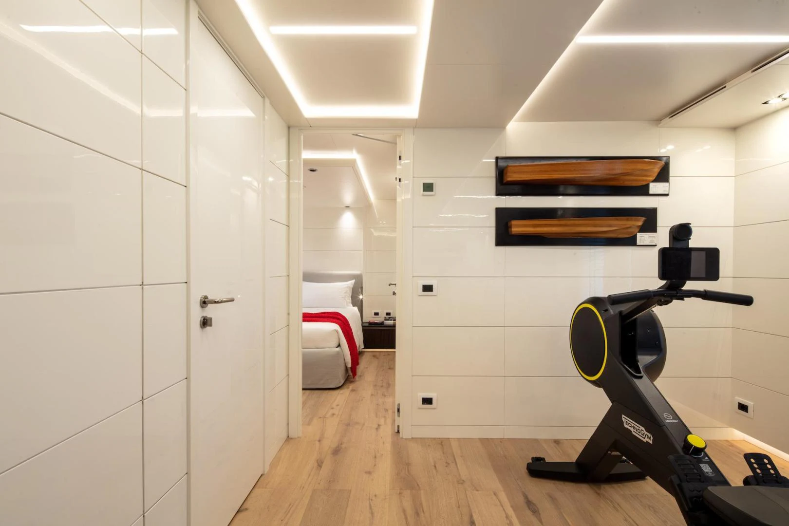 a gym with exercise equipment aboard ATOM Yacht for Sale