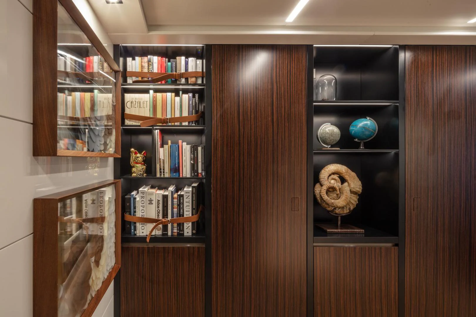a wooden cabinet with shelves aboard ATOM Yacht for Sale