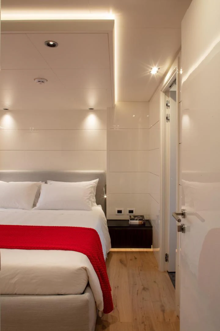 a bed in a room aboard ATOM Yacht for Sale