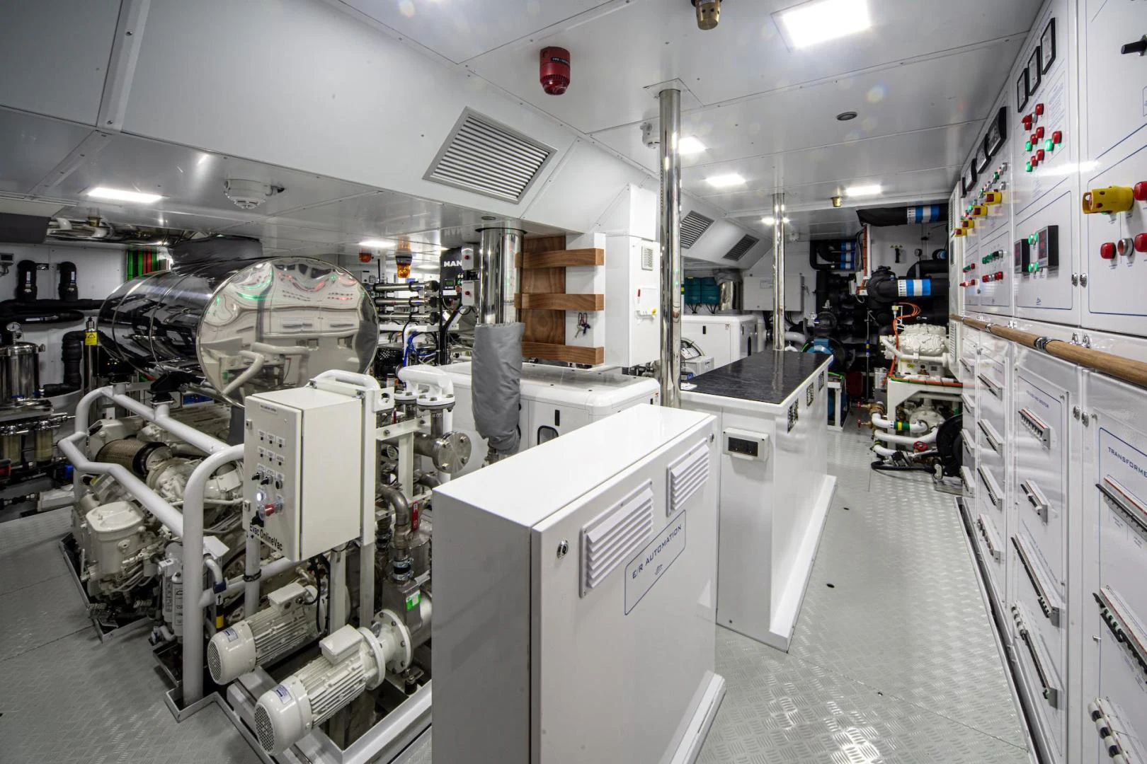 a room with several machines aboard ATOM Yacht for Sale