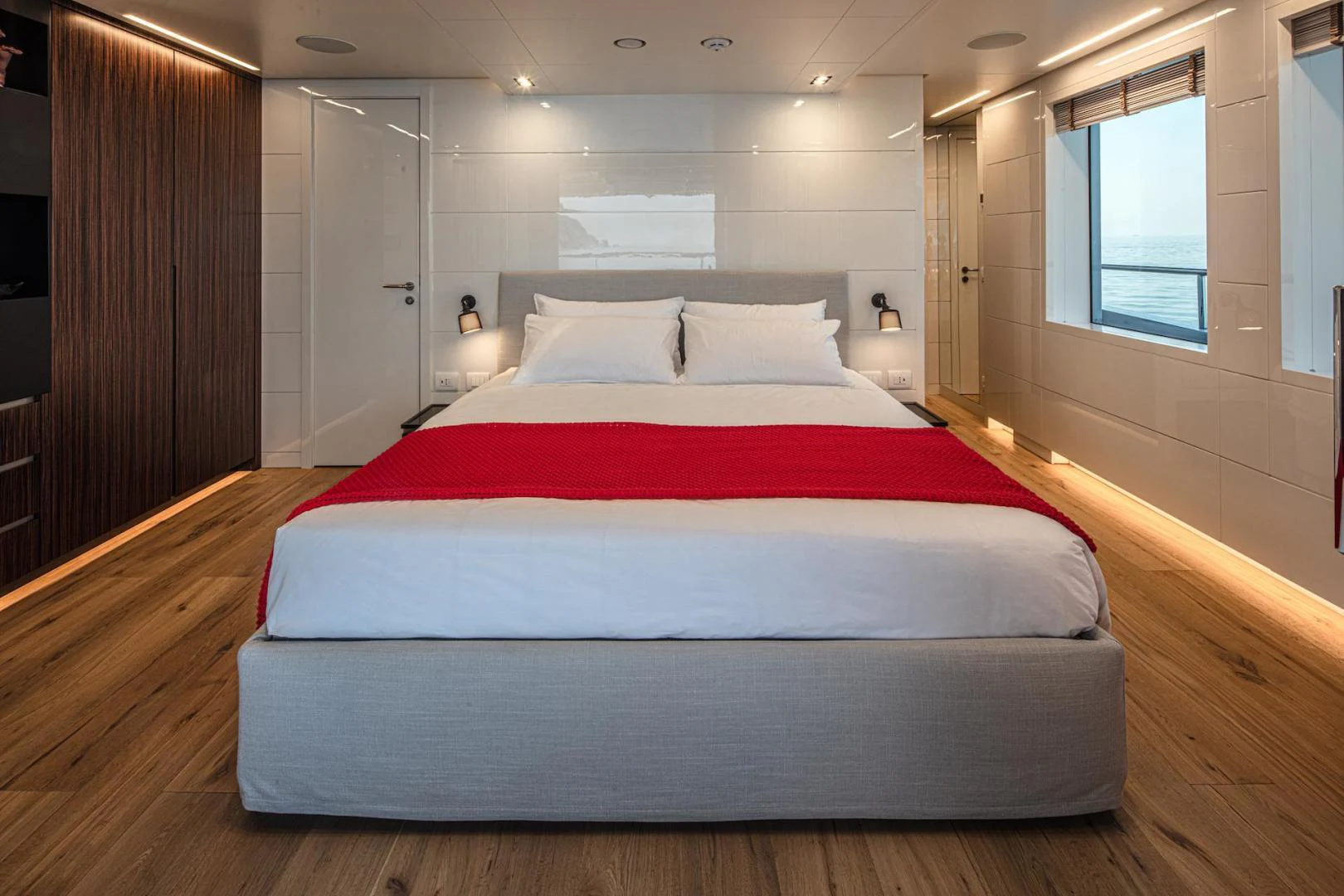 a bed in a room aboard ATOM Yacht for Sale