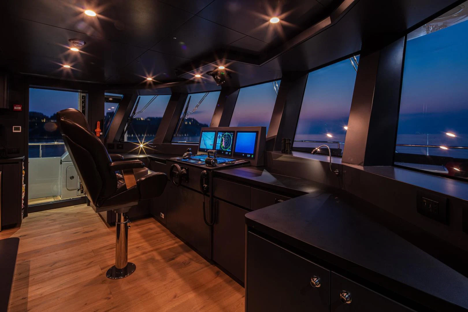 a room with a desk and computer aboard ATOM Yacht for Sale