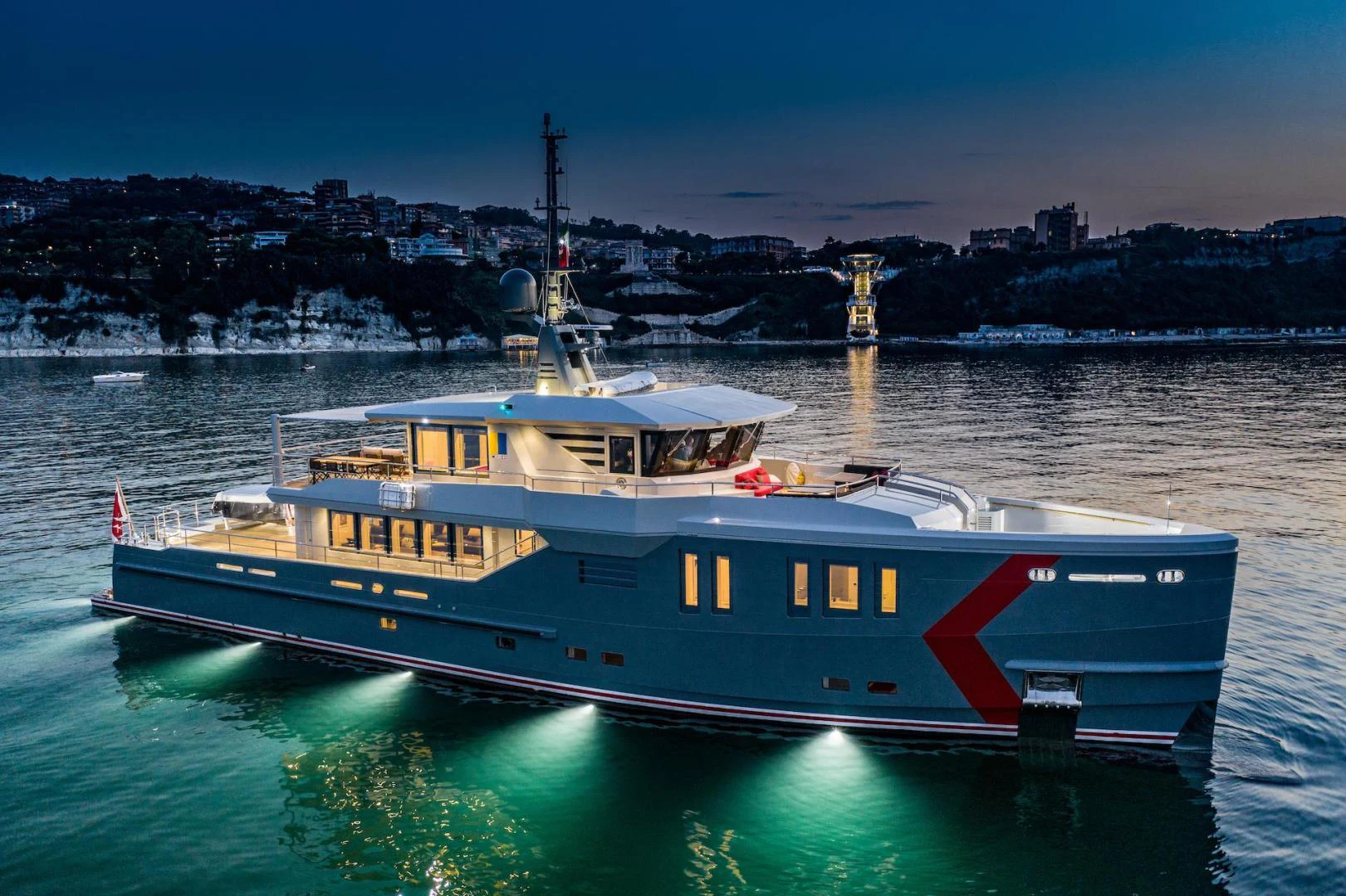 a large boat in the water aboard ATOM Yacht for Sale