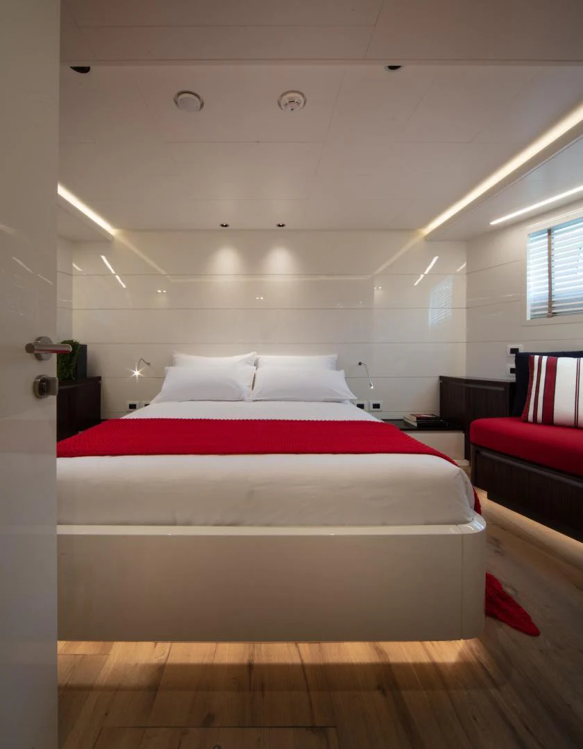 a bed in a room aboard ATOM Yacht for Sale