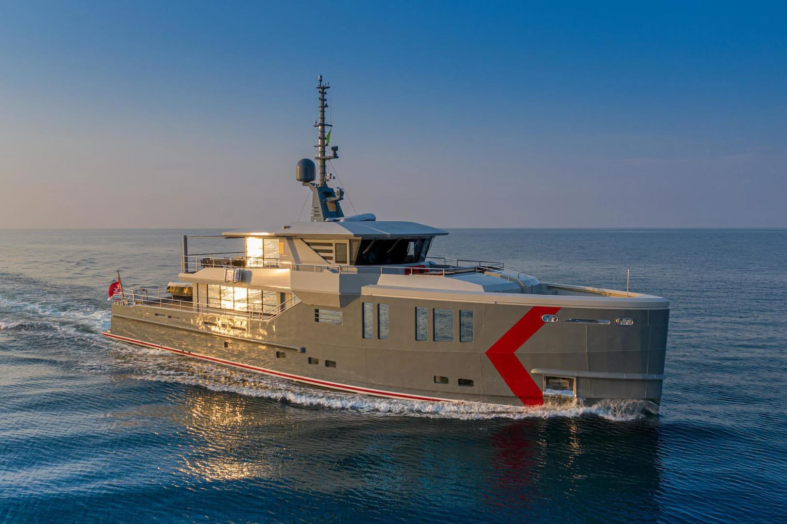 a large ship in the water aboard ATOM Yacht for Sale