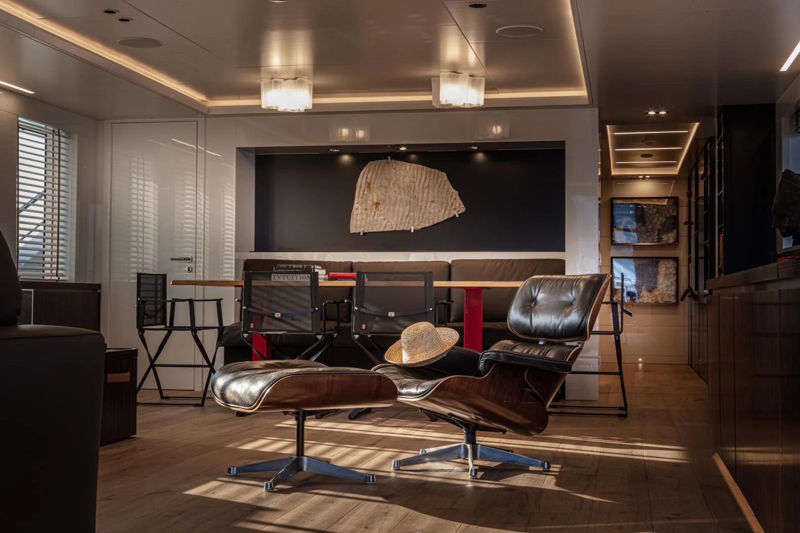 a living room with a large screen aboard ATOM Yacht for Sale