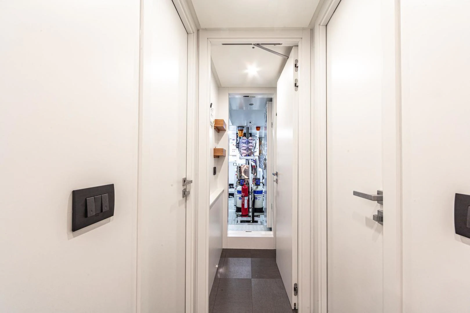 a hallway with doors aboard ATOM Yacht for Sale