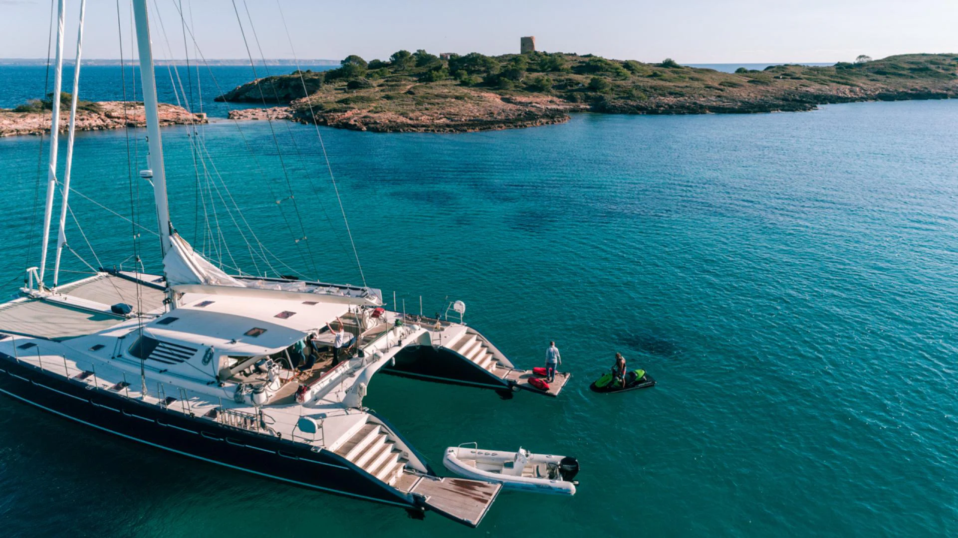a group of people sailing on a boat aboard AZIZAM Yacht for Sale