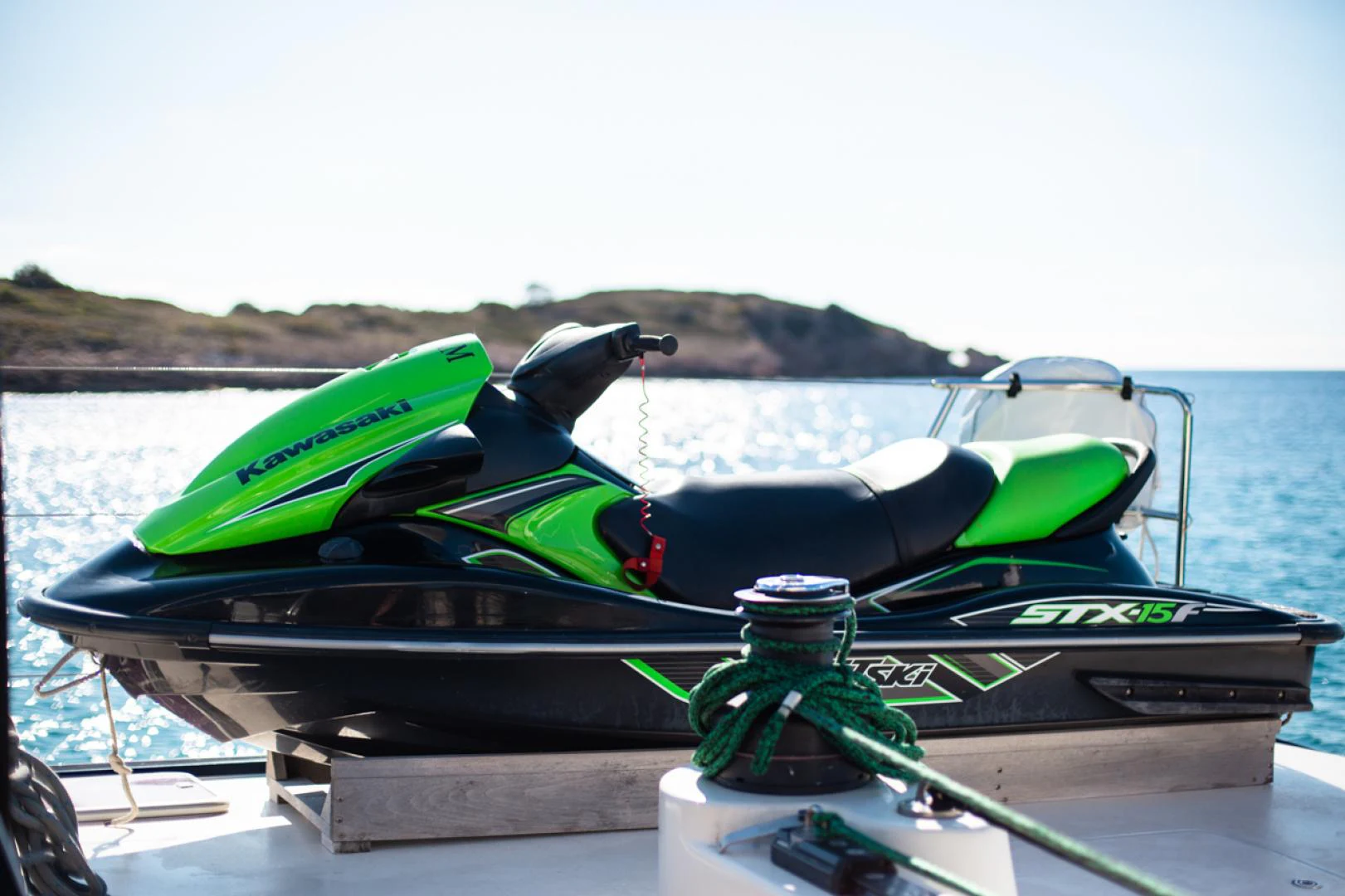 a green and black boat on water aboard AZIZAM Yacht for Sale