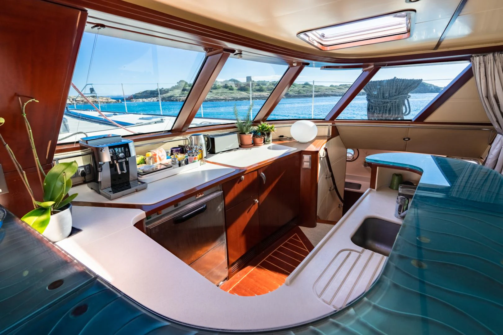 a room with a table and a window aboard AZIZAM Yacht for Sale