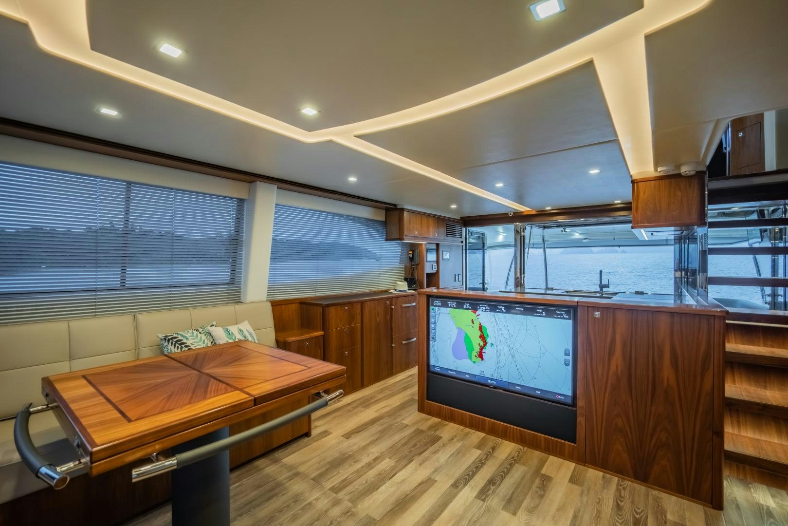 a room with a tv and a table aboard FAT BOY Yacht for Sale