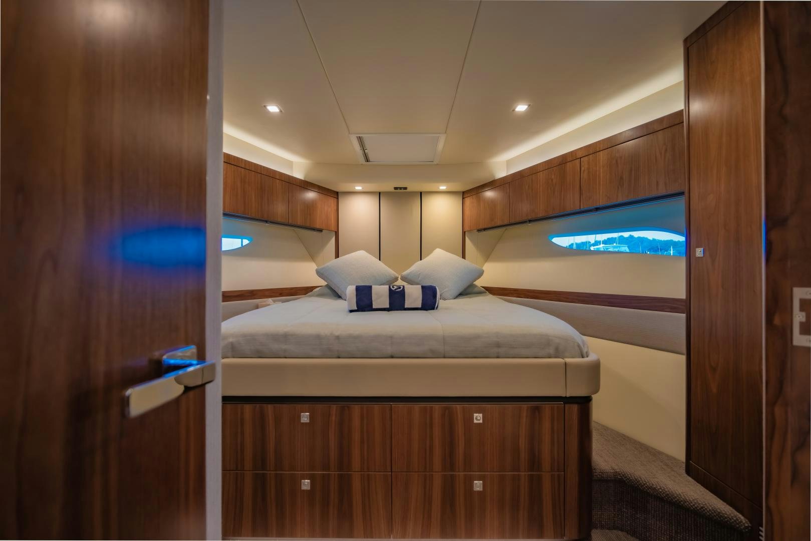 a room with a bed and a television on the wall aboard FAT BOY Yacht for Sale