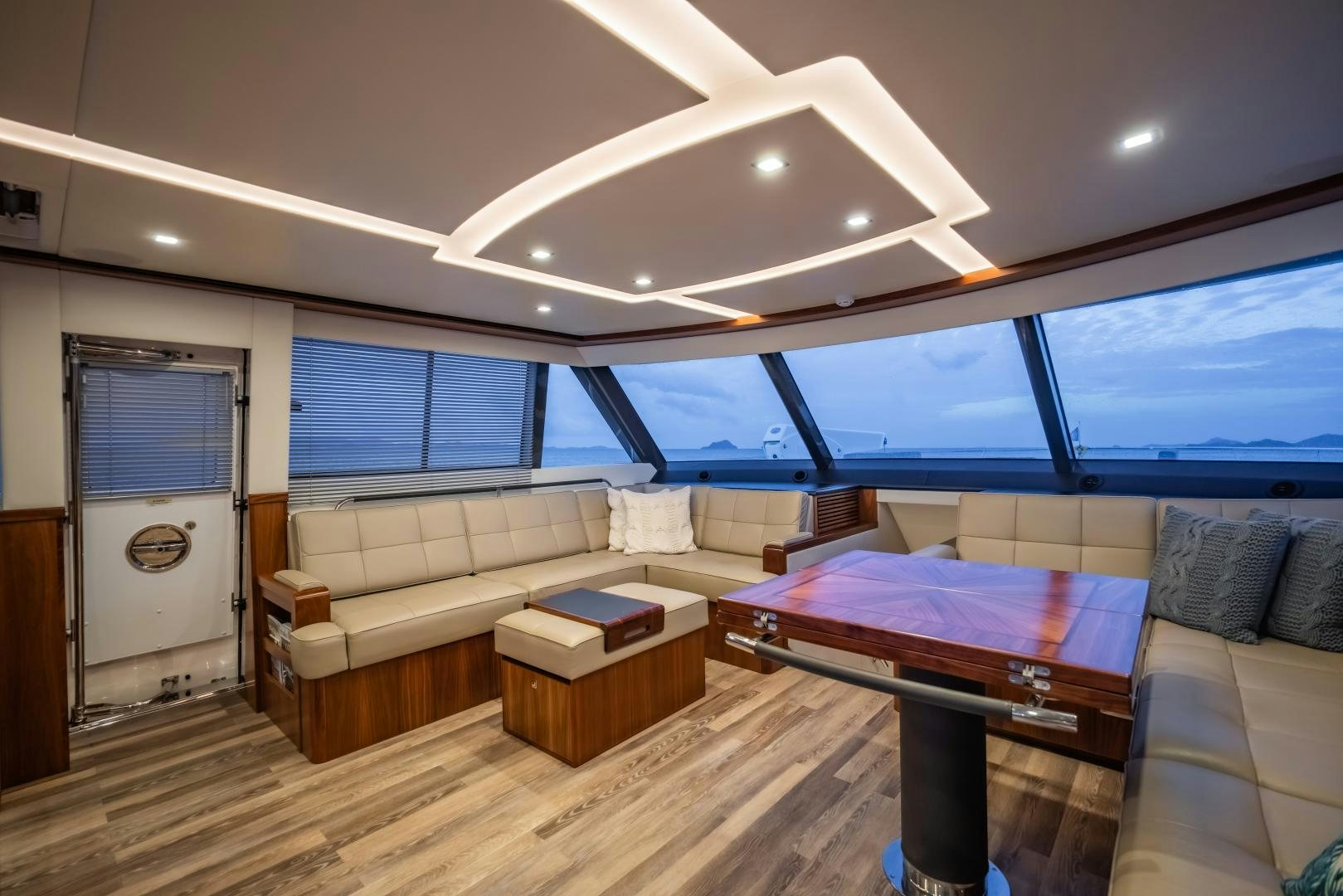 a living room with a couch and a table aboard FAT BOY Yacht for Sale